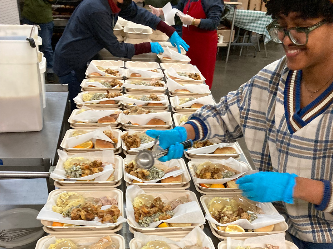 Volunteer helping to prepare Thanksgiving meal